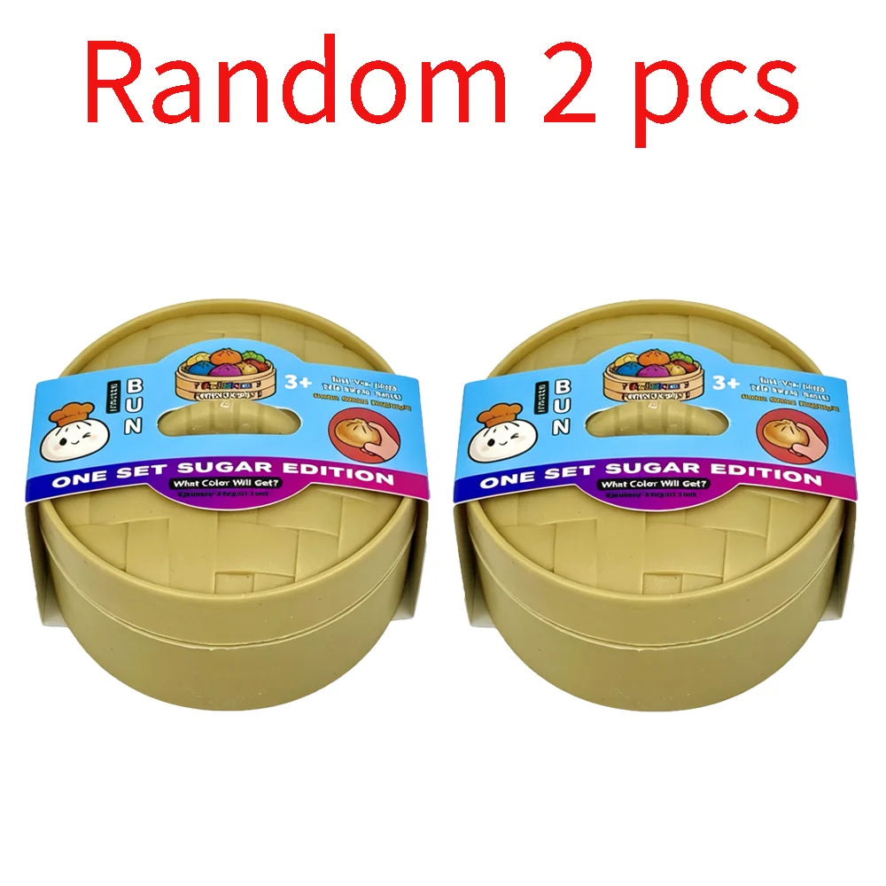 Two sets of random colored squishy dumplings in yellow containers