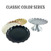A collection of classic color plastic cake stands including gold, cream, and black finishes.