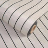 Roll of self-adhesive 3D wood grain wall panels showing a striped pattern.