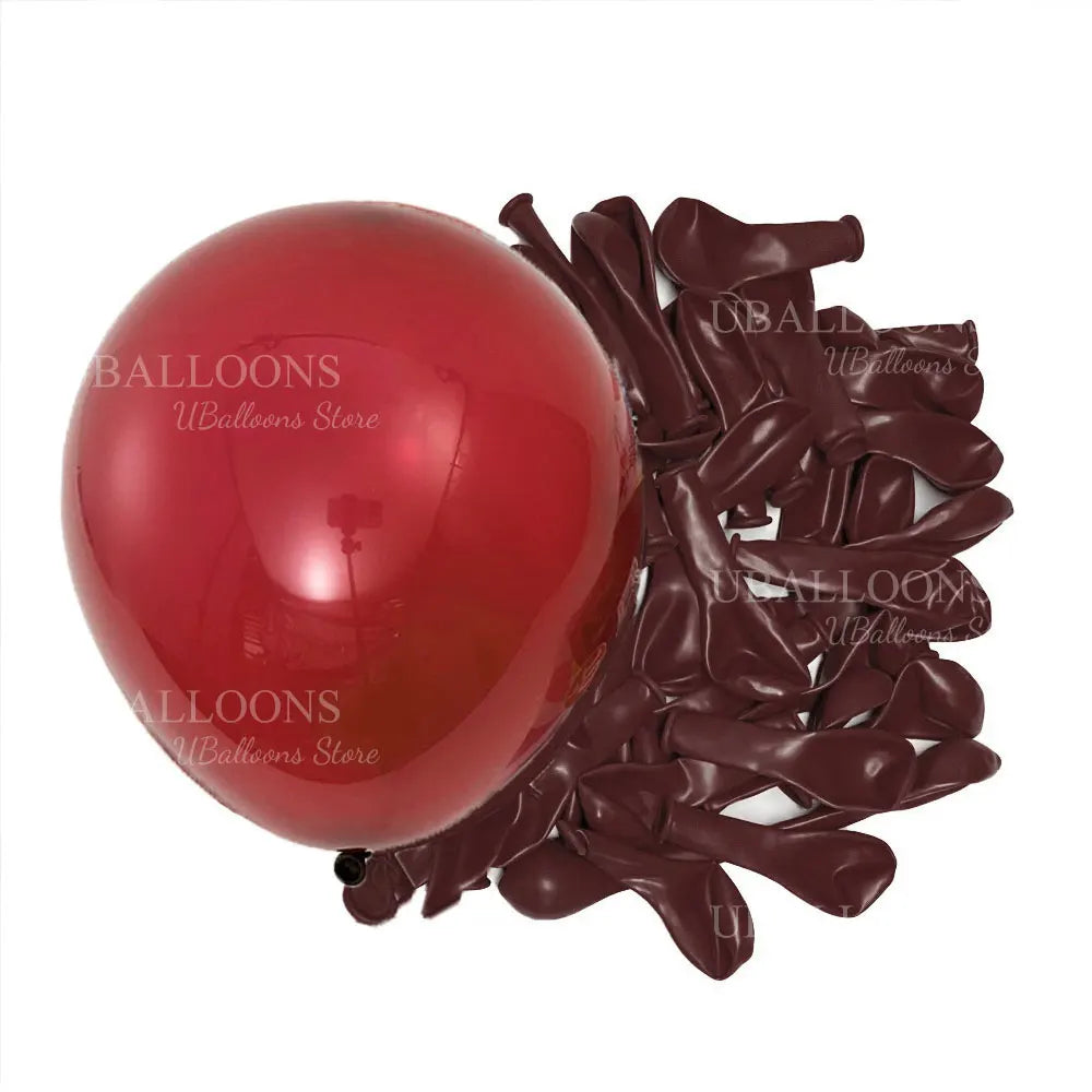 A cluster of deep burgundy latex balloons is shown next to a large, round red balloon.