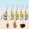 Acrylic keychain featuring a yellow banana cat and a black cat.