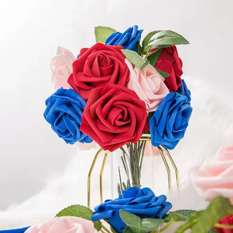 A bouquet of lifelike foam roses in shades of red, pink, and blue with green leaves.
