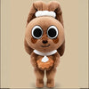 A brown plush doll resembling a dandy butterfly with white hair and a small pastry attached.