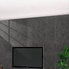 Matte marble self-adhesive waterproof wallpaper applied to a wall behind a television and furniture.