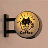 A magnetic fridge decor featuring a glowing light shaped like a cat face above the words WAKE CUP Coffee