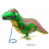 A green cartoon dinosaur foil balloon with a yellow neck and orange spots, shown in a side view.