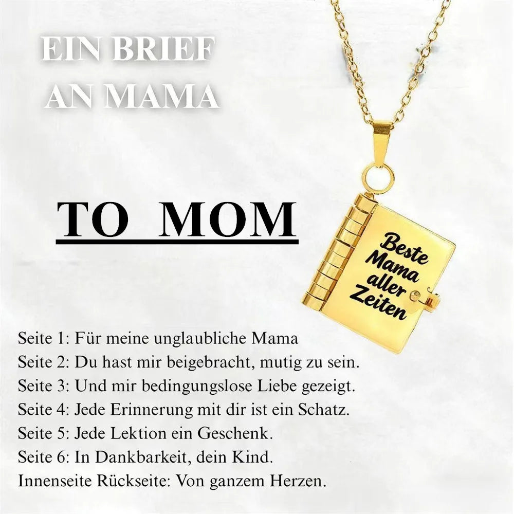 A gold pendant necklace shaped like an open book with text on it, featuring a message to mom.