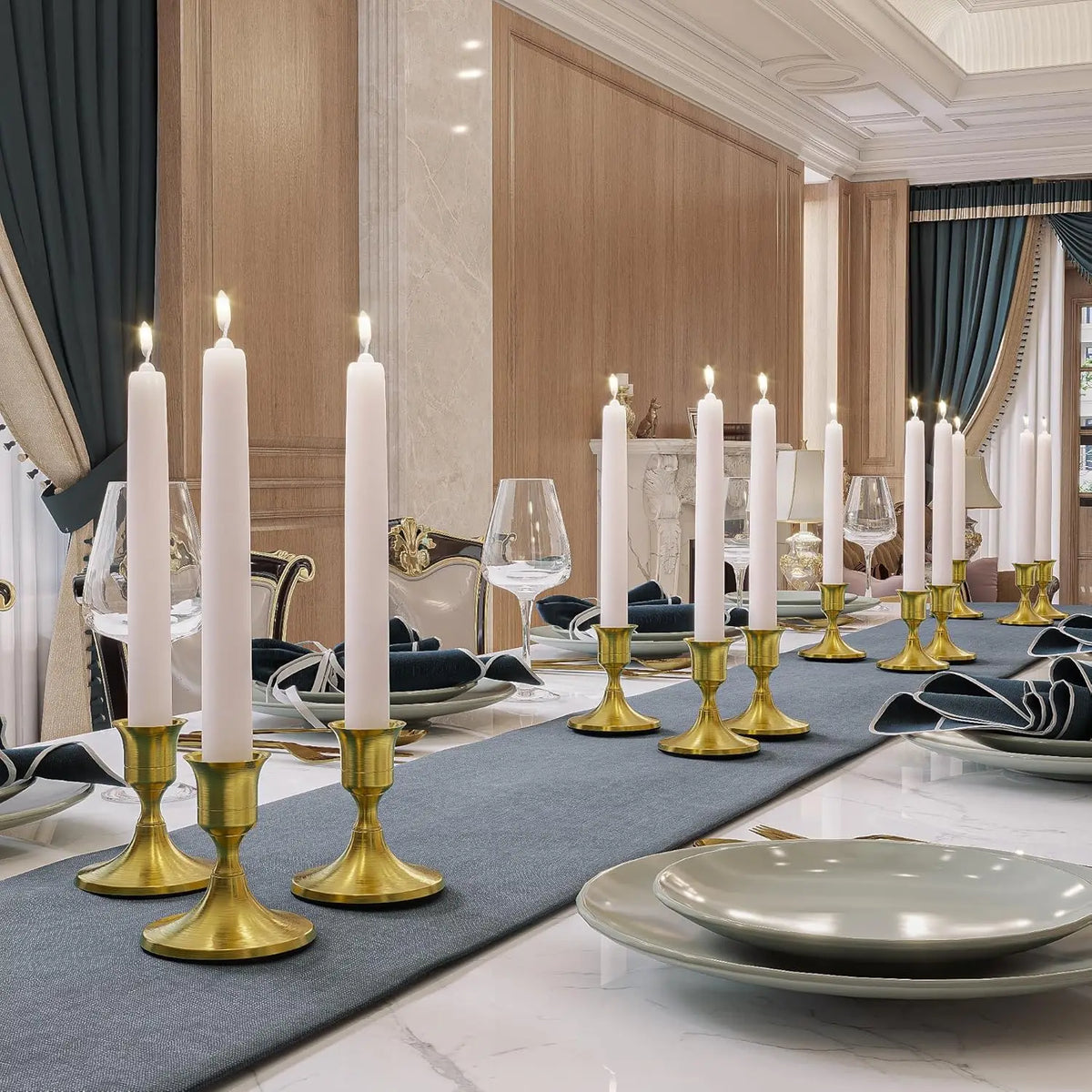 Vintage iron candlestick holders with white candles arranged on a table setting.