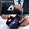 A hand holds a black leather wallet with a spade-shaped stainless steel bottle opener and a credit card.