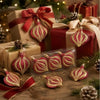 A collection of red and gold flat onion-shaped Christmas ornaments wrapped in festive paper and greenery.