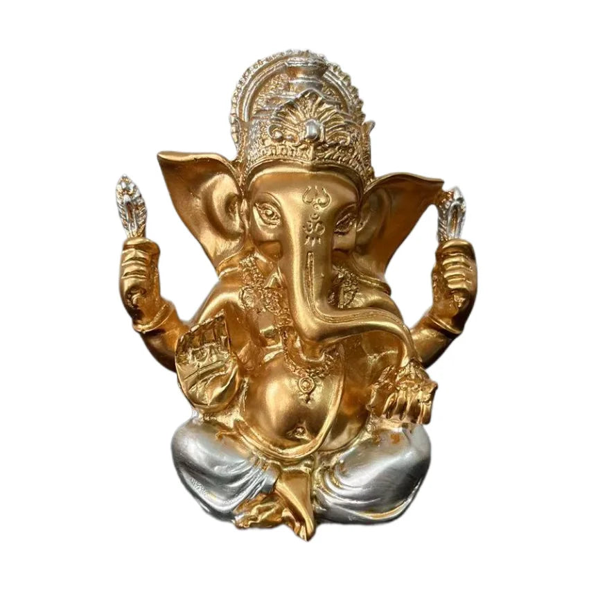 Golden Ganesha statue made of resin depicting the Hindu elephant god in a seated posture