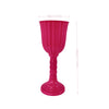 A bright pink, elegant cylinder flower vase with a flared rim and pedestal base.