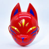 A bright red fox face mask with blue accents and yellow details.