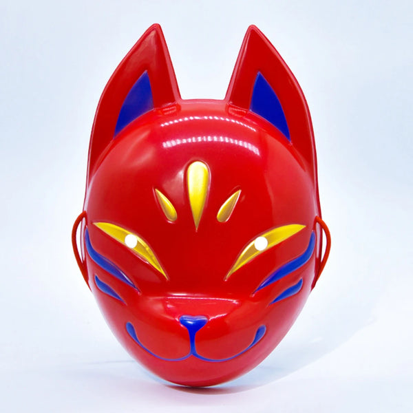 A bright red fox face mask with blue accents and yellow details.