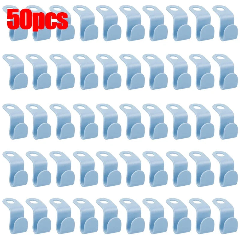 A set of 30 light blue space-saving hanger connector hooks for organizing items.