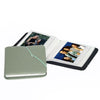 A green PU leather photo album with a black cover displaying instant camera prints.