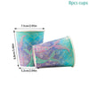 Eight cups of mermaid-themed party tableware featuring blue and purple scales and flowing fins.