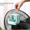 A hand is hanging a horizontal ring above the middle of a black portable ice-cooling floor fan.