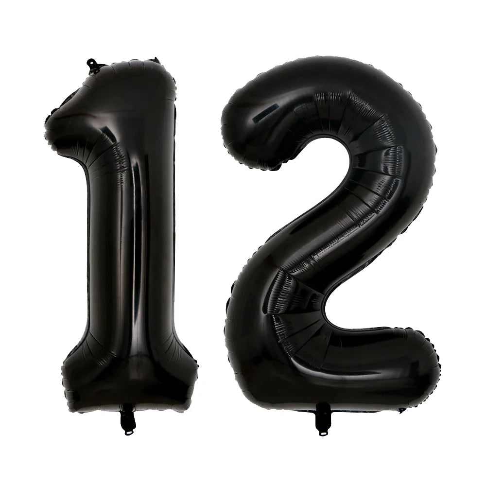 A set of two giant black foil balloons shaped like the numbers 1 and 2.