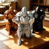 Three 3D printed medieval knight figurines in gold and silver armor standing on a wooden surface.