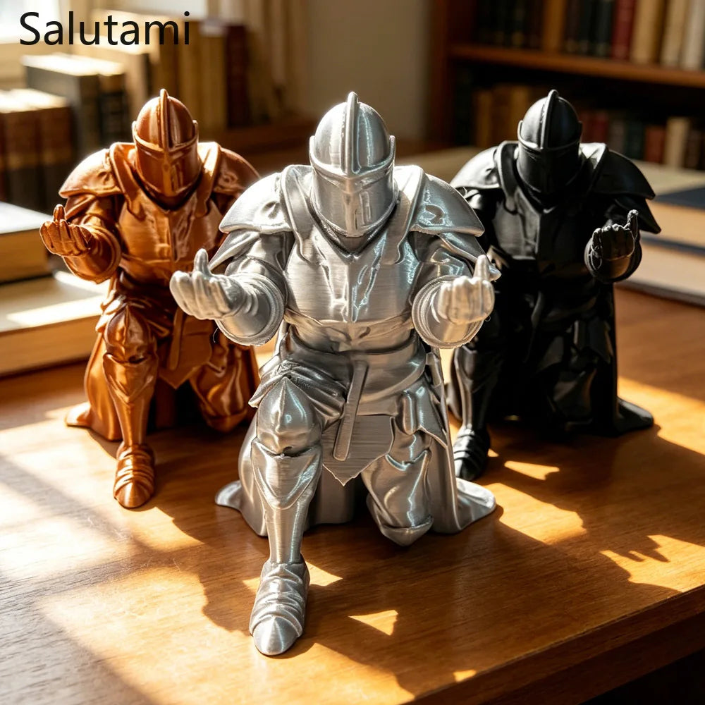 Three 3D printed medieval knight figures in metallic gold and silver standing on a wooden surface.
