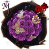 A bouquet of purple glitter artificial roses with gold butterfly accents displayed in a dark box.