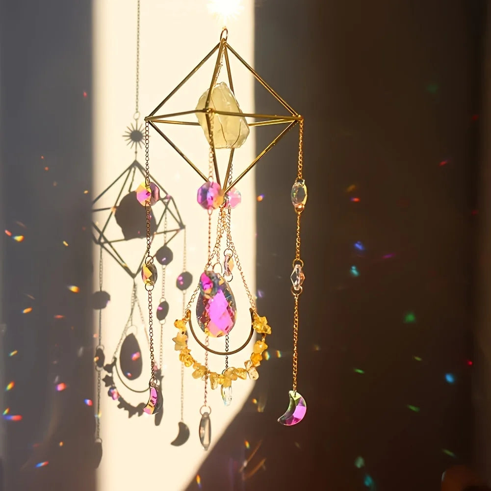 A hanging crystal sun catcher featuring geometric gold wirework and colorful gemstone beads.