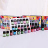 A set of essential oils in small glass bottles displayed in colorful cardboard boxes.