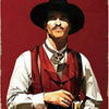 Vintage western movie tin sign featuring a man in a hat and vest with the text I'm your huckleberry