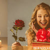 A personalized couple's gift featuring a glowing acrylic frame with names and date, alongside a woman holding a red rose and 