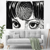 A black and white tapestry featuring a stylized, intense eye design inspired by Junji Ito manga.