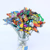 A bouquet of colorful decorative butterfly garden stakes in a glass jar.