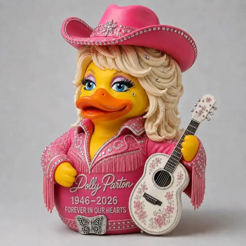 A figurine of a woman with blonde hair wearing a pink cowboy hat and a pink shirt holding an acoustic guitar.