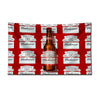 A red flag featuring repeated designs of Budweiser beer bottles and logos.