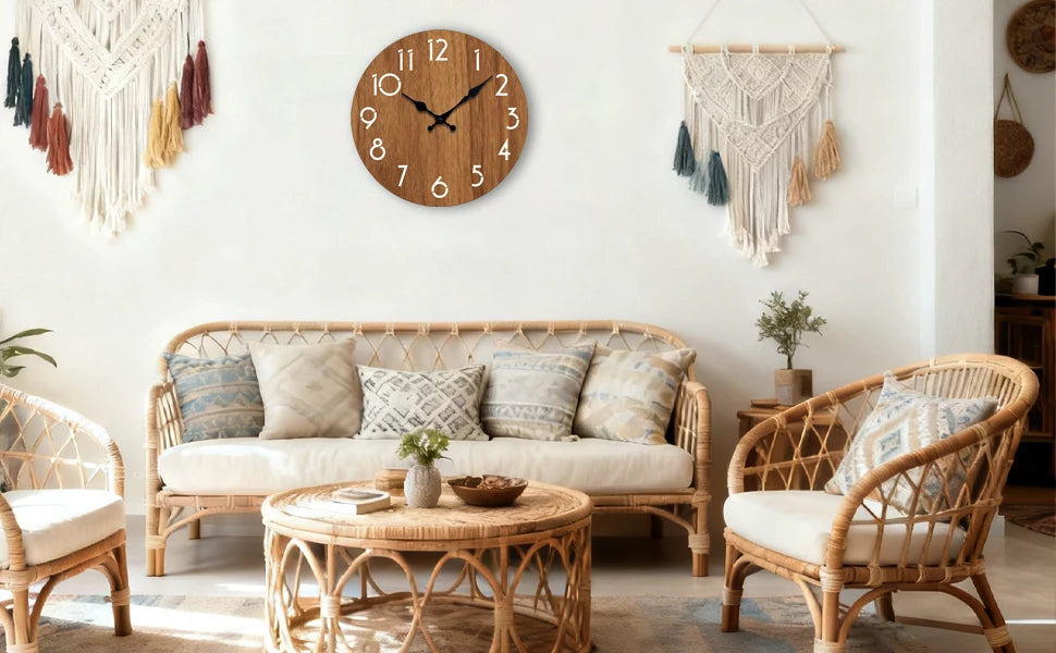 A living room features a minimalist wooden wall clock above a sofa and two wicker armchairs.