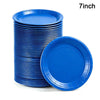 A stack of blue 7-inch disposable paper plates, including one plate lying separately.