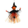 A Halloween ornament featuring a witch with an orange face, black hat, and a sheer orange dress.