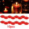 A set of ten red floating candles in glass holders used for romantic home décor.