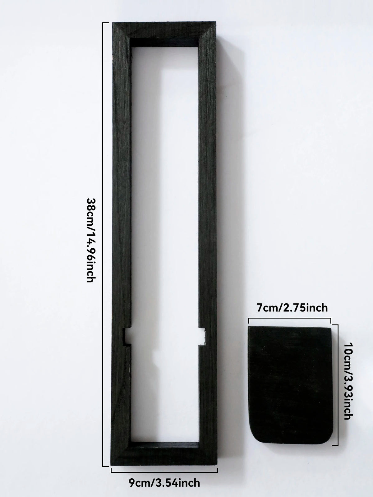 A vertical black wooden frame for a wall shelf with a rectangular cutout and a square mounting piece.
