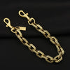 A gold and silver two-tone metal chain necklace with a pendant displayed against a black background.
