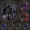 A collection of vintage vinyl record wall clocks mounted on a gray brick wall.