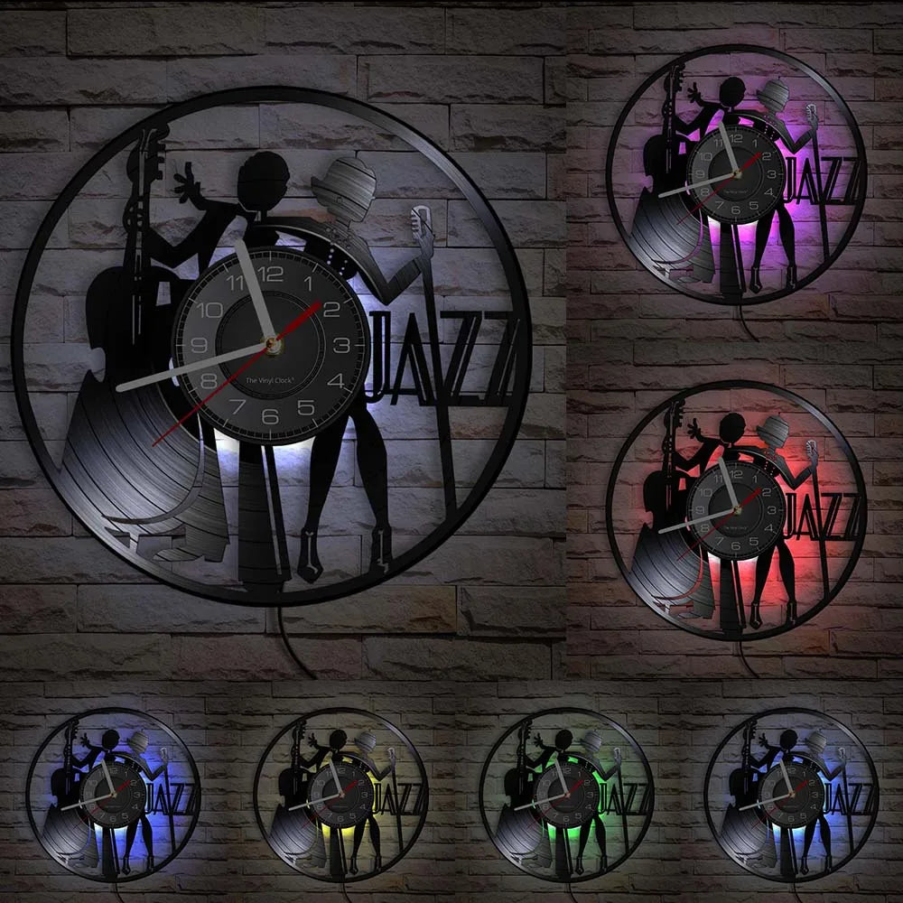 A collection of vintage vinyl record wall clocks mounted on a gray brick wall.