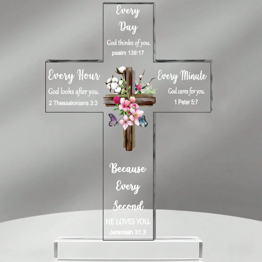 A clear acrylic cross with various Bible verses inscribed on its arms, featuring themes of God's presence and love.