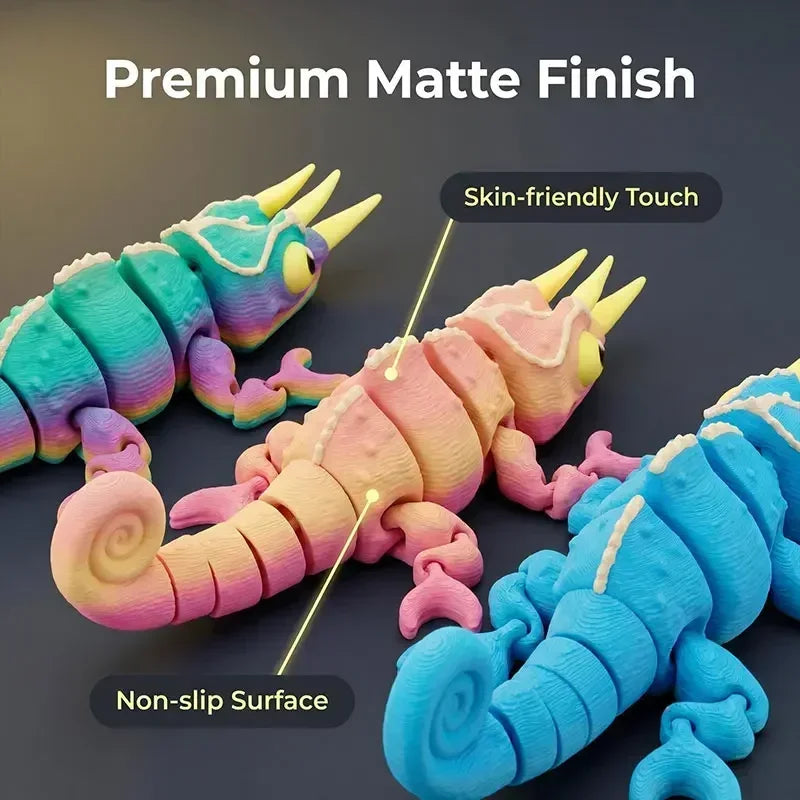 A close-up of a blue and pink chameleon fidget toy showing a matte finish texture.