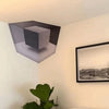 A wall decal featuring a 3D optical illusion of an impossible maze cube pattern on a white wall.
