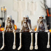 A set of three skull figurines depicting hands covering faces, used for a See No Evil Hear No Evil Speak No Evil theme.