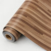 Roll of realistic wood grain floor stickers showing parallel brown planks.