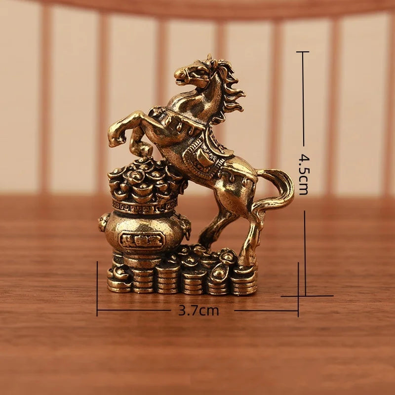 A solid copper figurine of a rearing horse atop a base, symbolizing prosperity and positive energy.