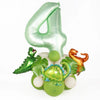 A set of foil balloons shaped like the number 4 and various dinosaur figures in avocado green and orange for a birthday decor