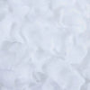 White silk rose petals scattered on a surface for weddings and special events